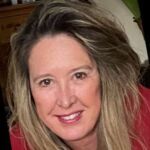 Headshot of smiling woman with blond hair